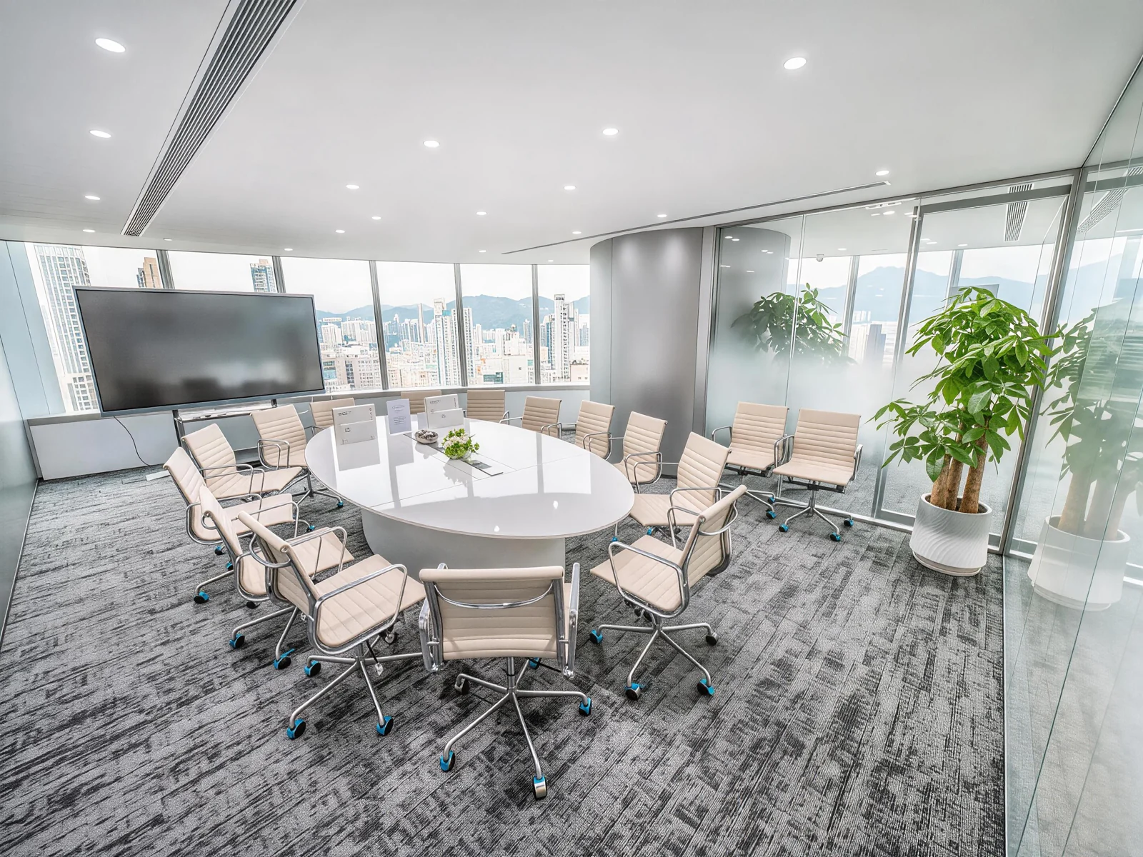 Futurevita Hong Kong boardroom with a white meeting table, cream chairs and presentation screen.
