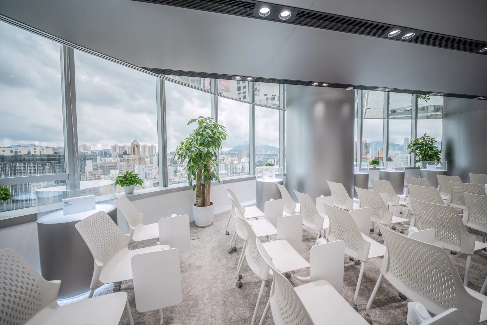 High-density training floor with folding desks and panoramic glazing — programme-critical space delivered on schedule by Roky Design